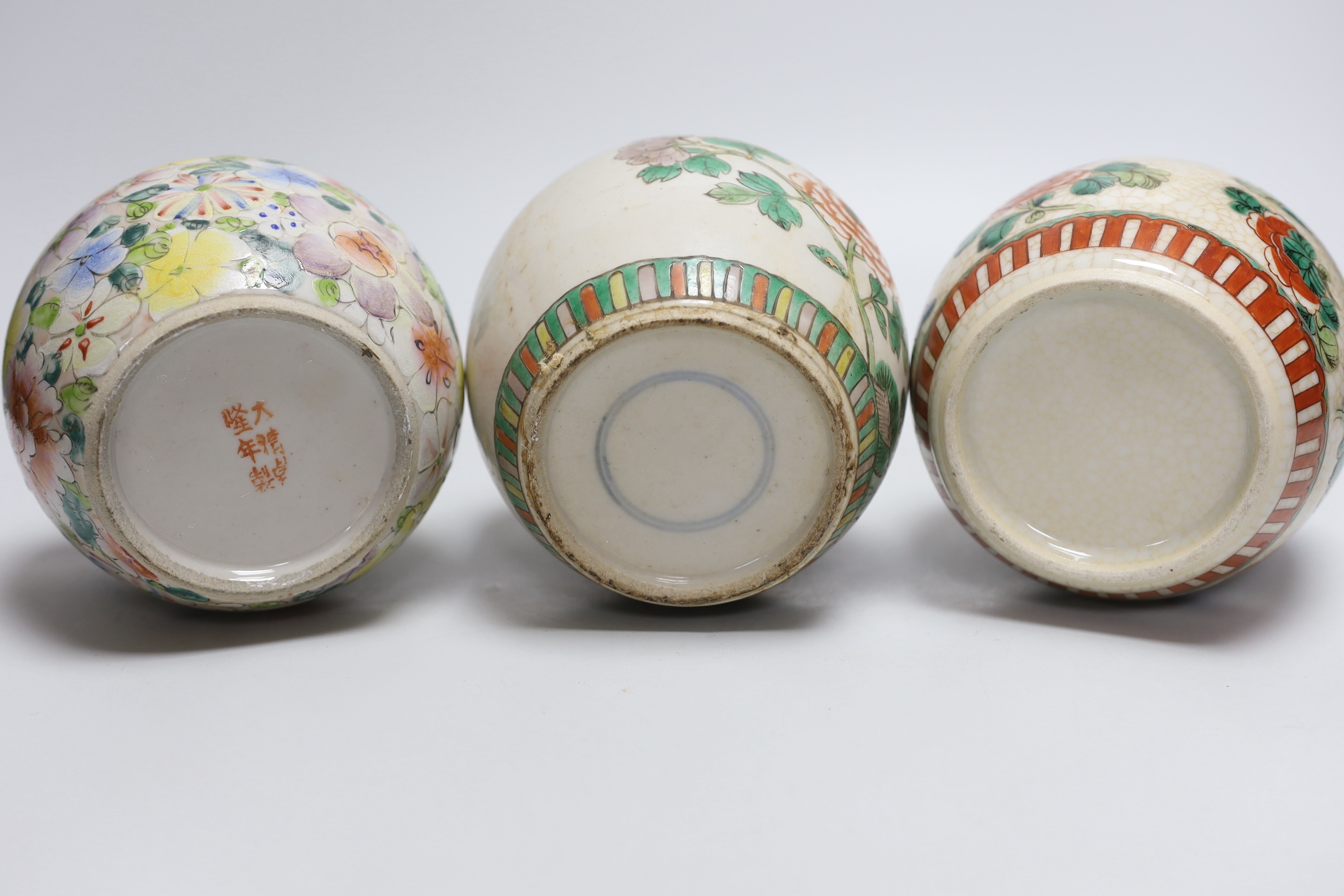 Five Chinese enamelled porcelain ginger jars, one with a cover, tallest 12cm high